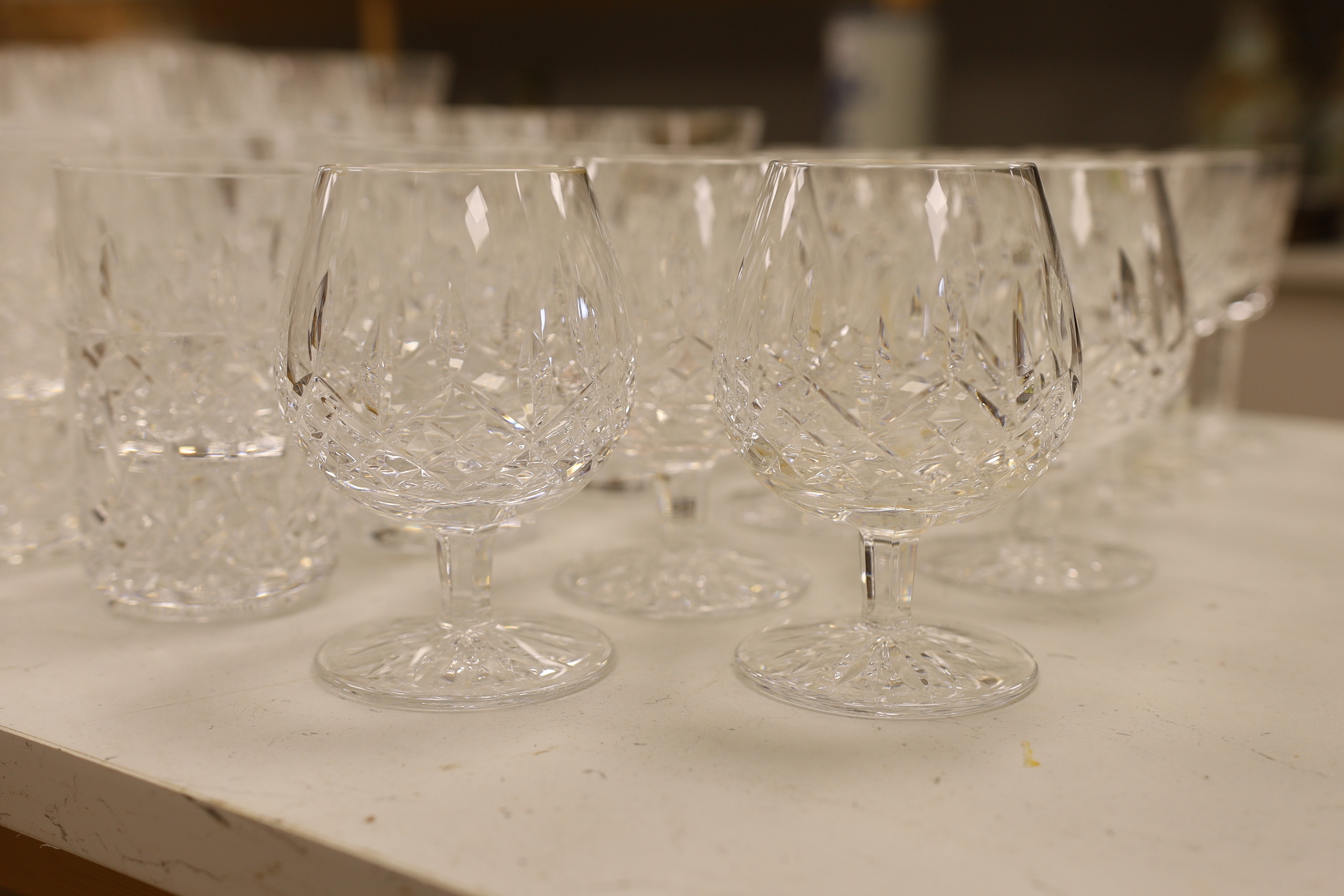 A 68 piece part suite of Waterford cut crystal ‘’Lismore’’ pattern drinking glassware, consisting:- 12 champagne glasses, 9 red wine glasses, 6 white wine glasses, 12 liqueur glasses, 12 whisky tumblers, 12 sherry glasse
